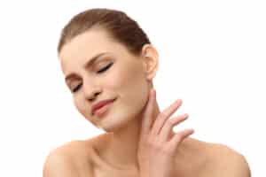 An otoplasty patient considering the details of cosmetic ear surgery - otoplasty from a board-certified plastic surgeon in Miami, FL.