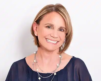 Happy woman after a Blepharoplasty surgery in Miami.
