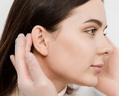 Woman showing right profile.