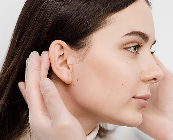 Woman showing right profile.
